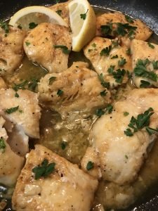 Buttered cod with garlic and lemon on stove top easy recipe