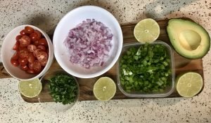 Green_onion_red_onion_lime_cilantro_tomatoes_ingredients_salmon_quinoa_salad_bowl