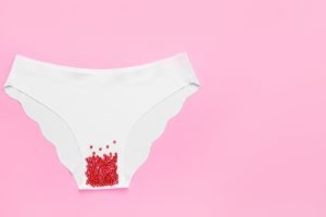 Female panties with red beads on Implantation